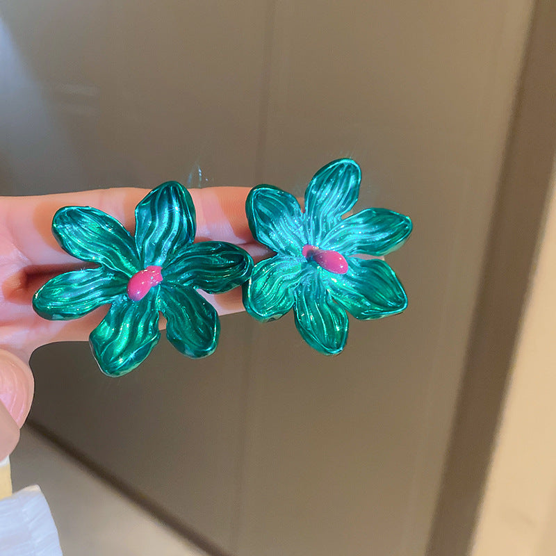 metallic green floral earrings! on hand
