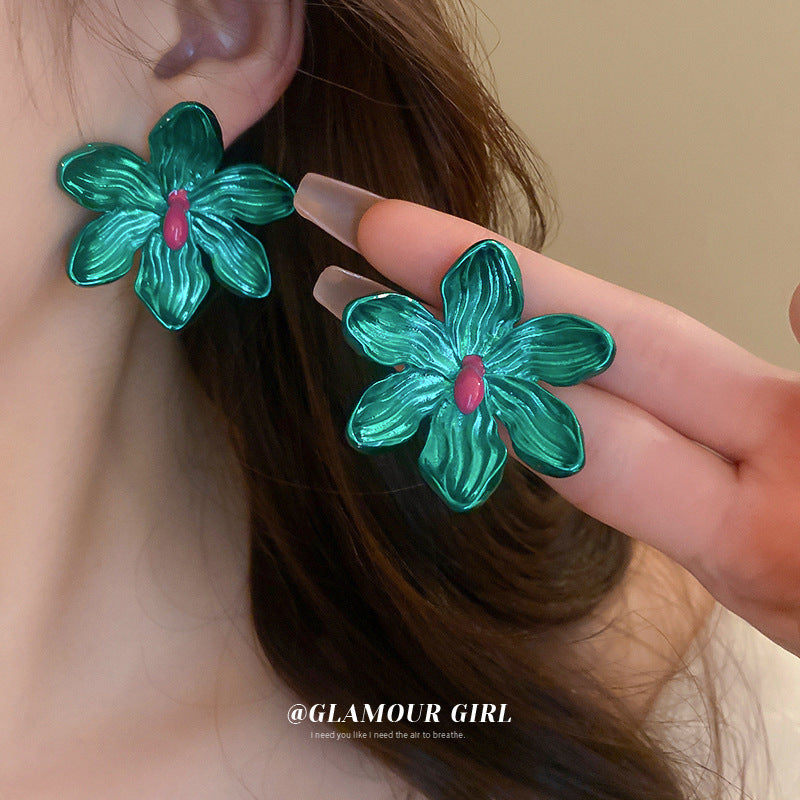 metallic green floral earrings! on ear